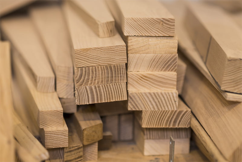 Various sizes of softwood timber stacked together