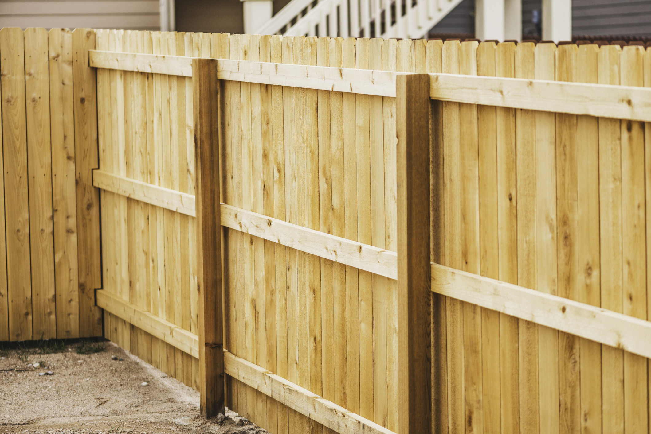 Newly completed timber fence shown with posts, rails and palings.