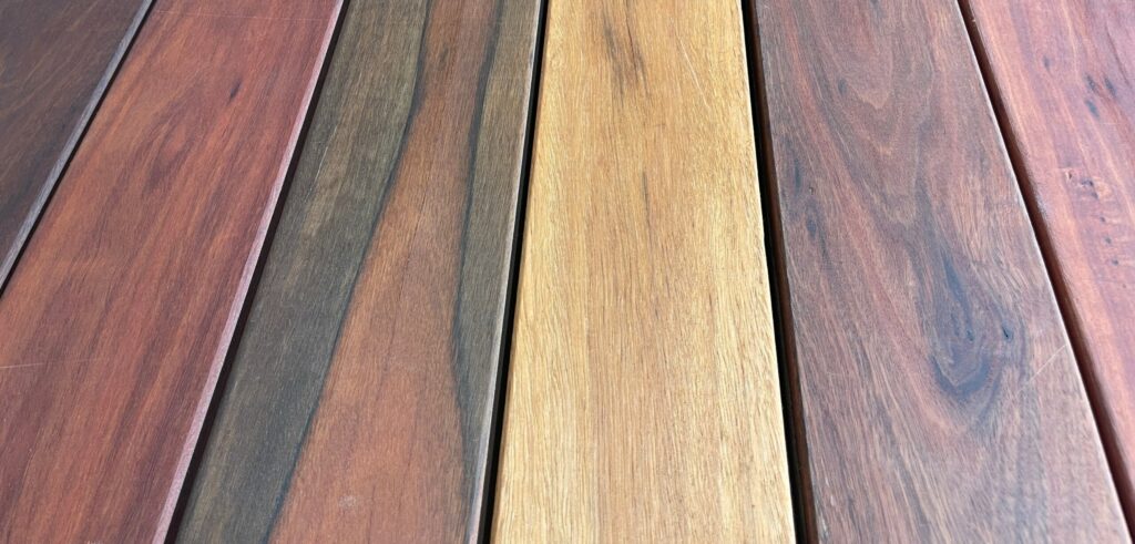 Ironbark timber decking pieces displayed side-by-side. Different colours of iron bark timber displayed next to each other to show variation