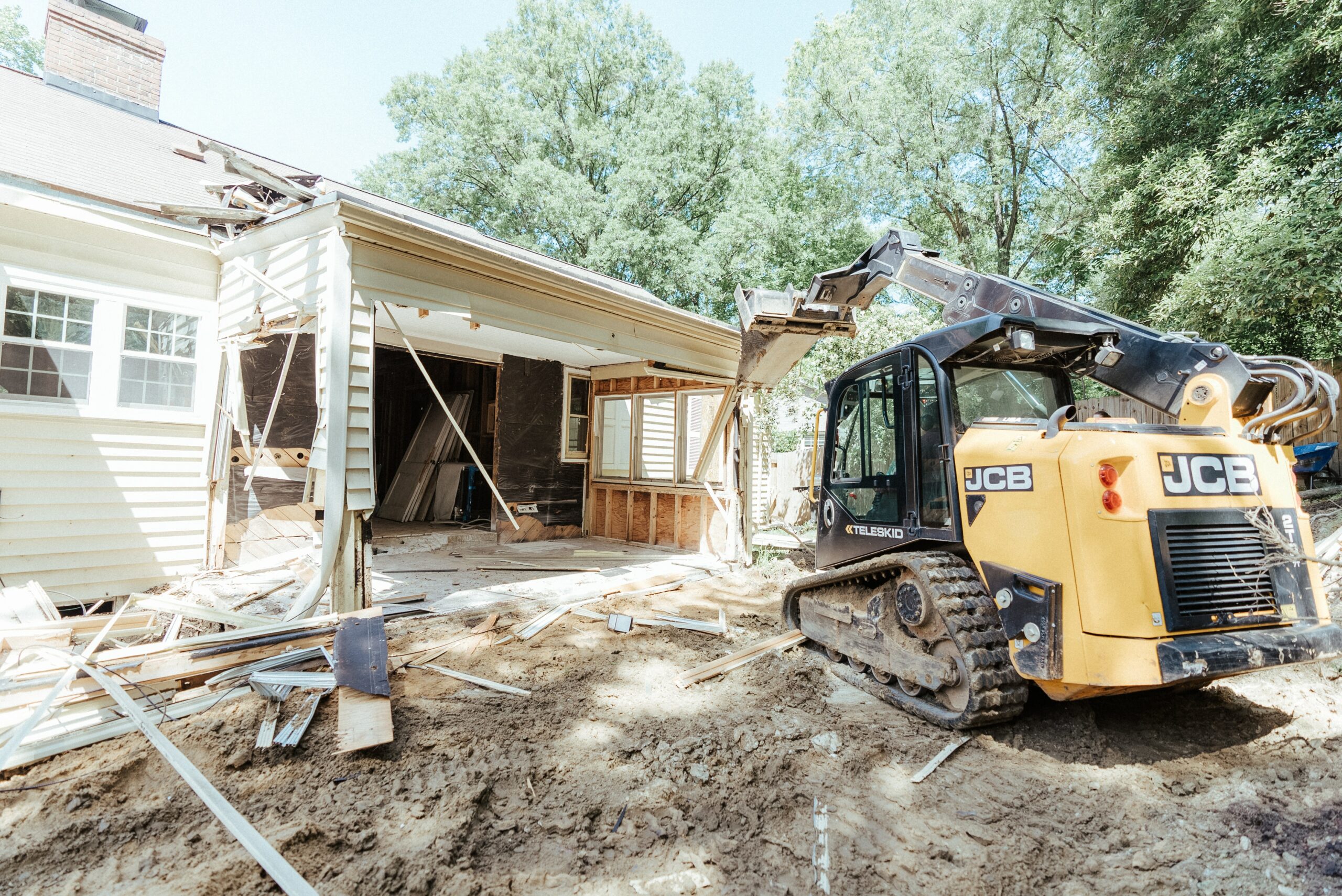 house with timber cladding being demolished
