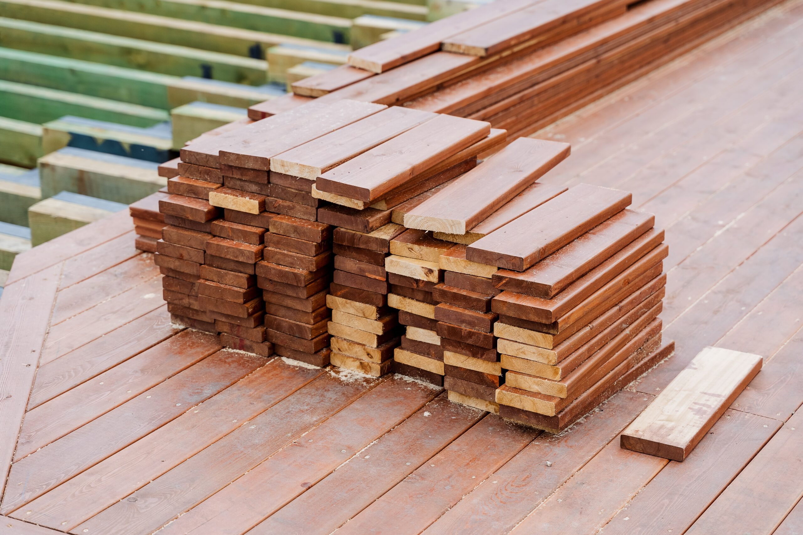 Pile of leftover offcuts of timber decking boards, ready to be used in other projects
